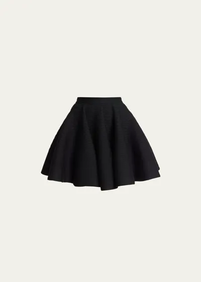 Alaïa Ribbed Flared Mid-rise Wool-blend Mini Skirt In Noir Alaia