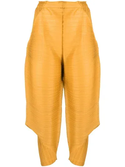 Issey Miyake Cropped Pleated Trousers In Yellow