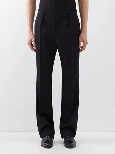 Saint Laurent Tapered Pleated Wool Trousers In Black